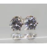 A pair of 18ct white gold diamond ear studs, set with estimated approx 0.80cts in total of brilliant