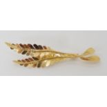 A French 18ct gold leaf brooch, stamped with the French hallmark of the eagles head, length 5.8cm,