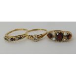 A 9ct garnet and pearl ring size K1/2, a sapphire and clear gem ring size Q and a 9ct diamond accent