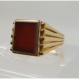 A 9ct gold gents carnelian signet ring, size U1/2, weight 8.1gms Condition Report: Available upon