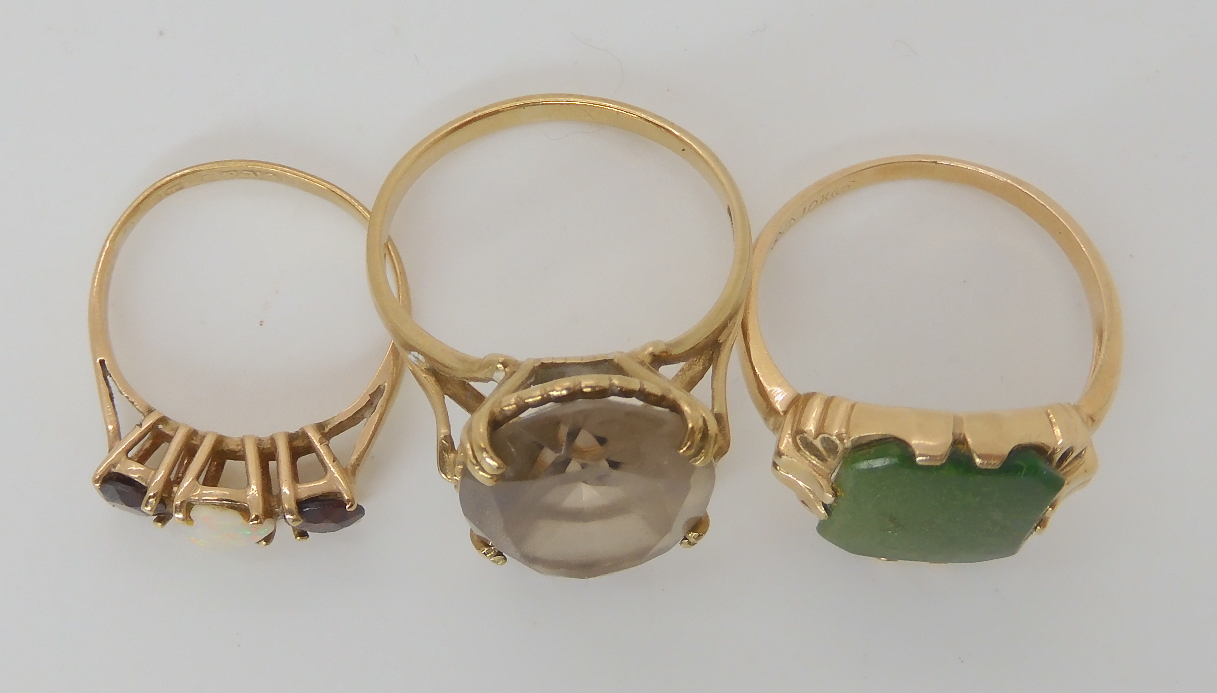 A 10k gold ring set with a green gemstone size M1/2, a 9ct smoky quartz style ring size N1/2 and a - Image 2 of 2