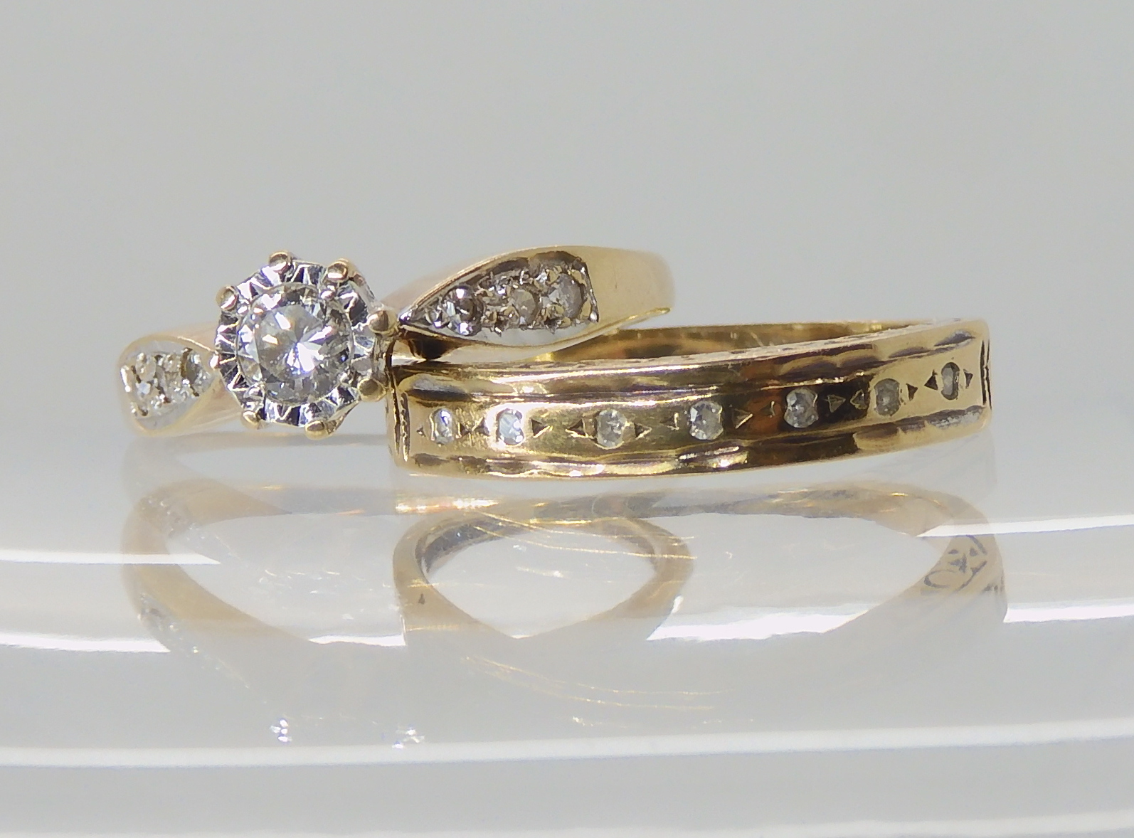 A 9ct gold diamond ring set with estimated 0.25cts of brilliant cut diamonds, size M, together