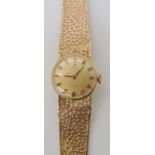 A 9ct gold ladies Tissot Stylist wristwatch, with integral strap, complete length 15.5cm, weight