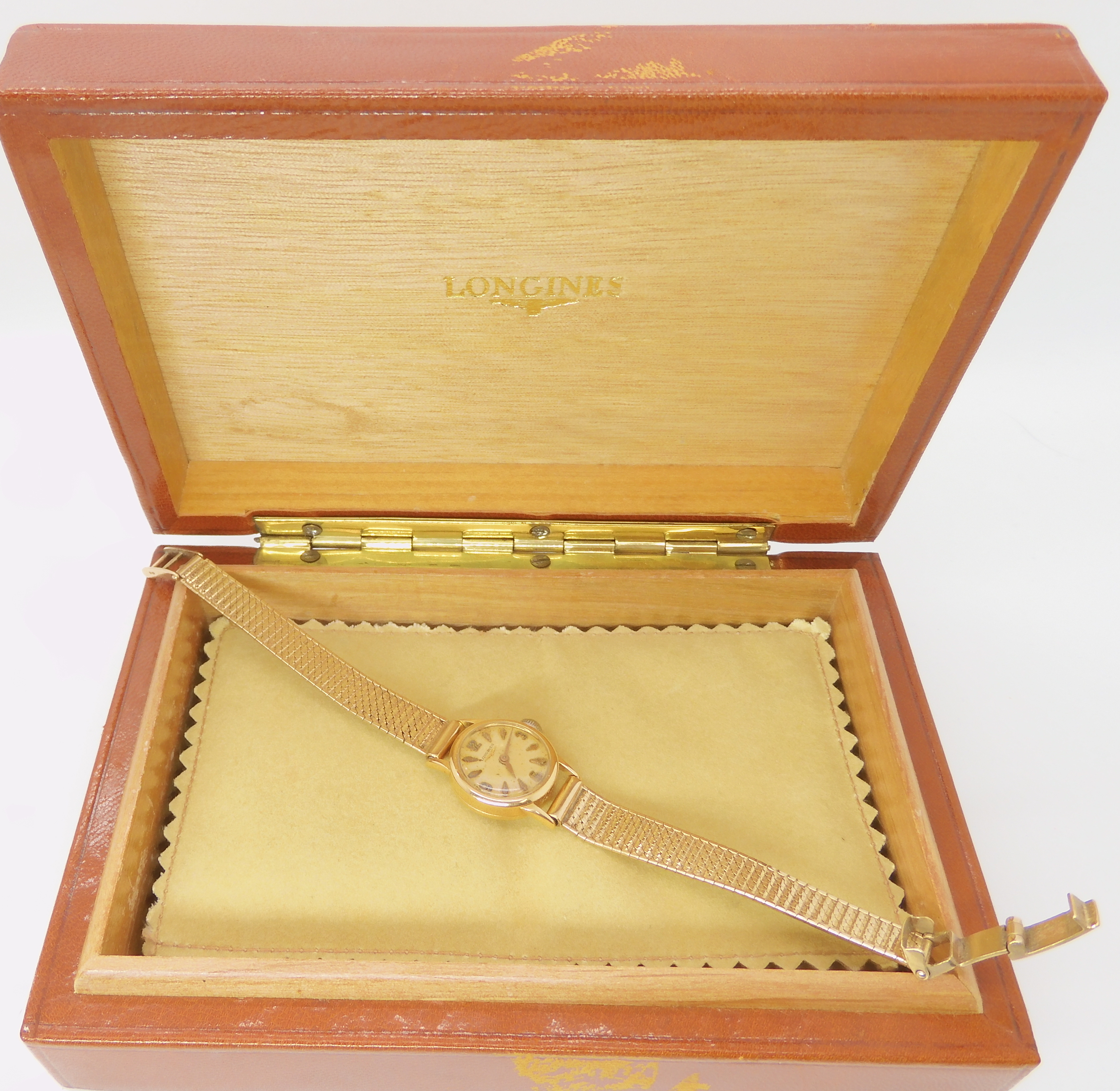 A 18ct gold ladies Longines watch head with a 9ct gold strap, combined weight 21.1gms Condition