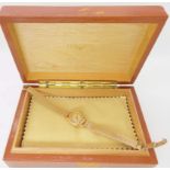 A 18ct gold ladies Longines watch head with a 9ct gold strap, combined weight 21.1gms Condition