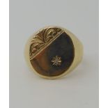 A 9ct gold gents signet ring set with a diamond, finger size R1/2, weight 5.7gms Condition Report: