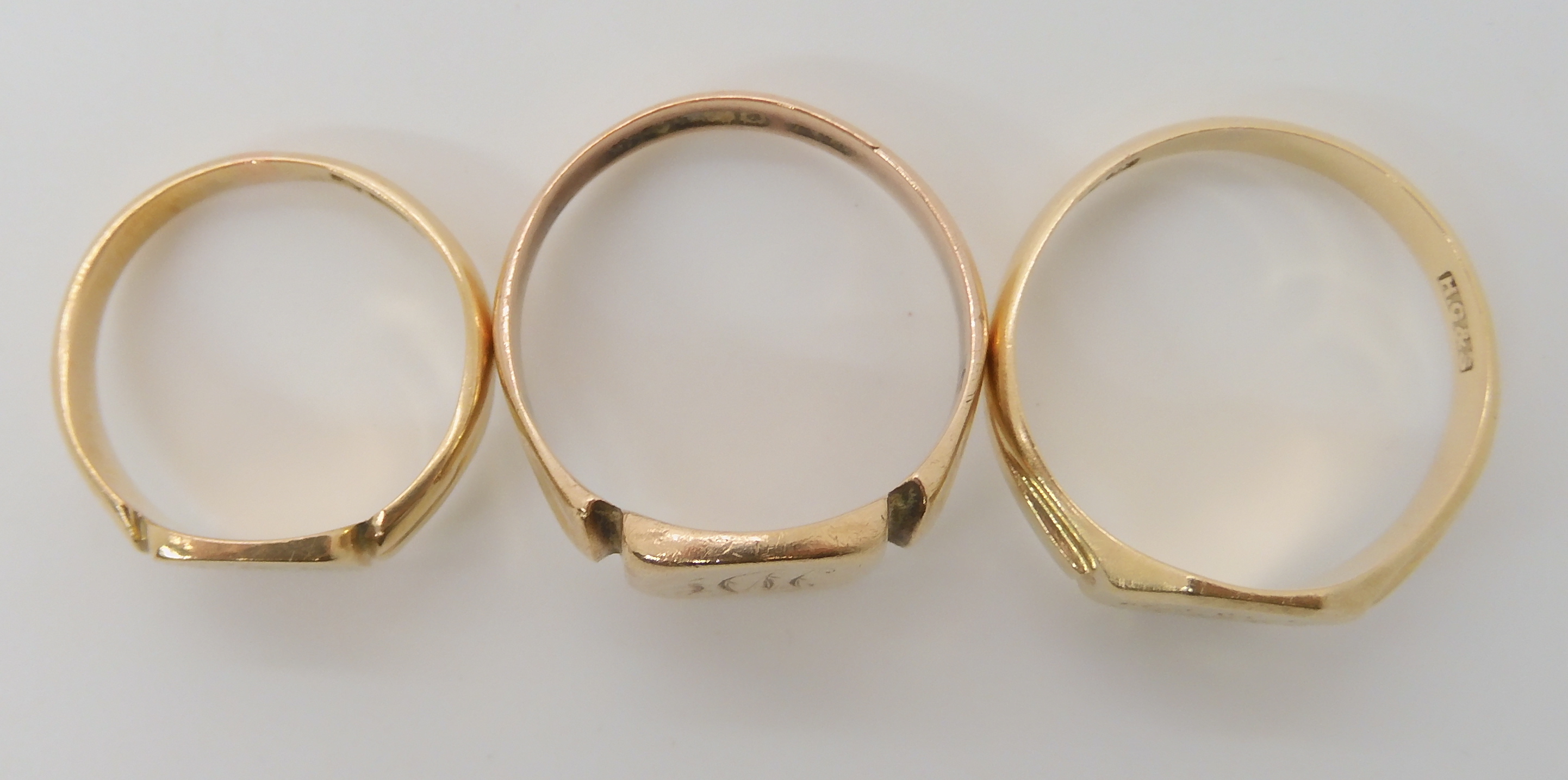 Three 9ct gold signet rings, sizes V1/2, U1/2 and N1/2 combined weight 12.8gms Condition Report: - Image 2 of 3