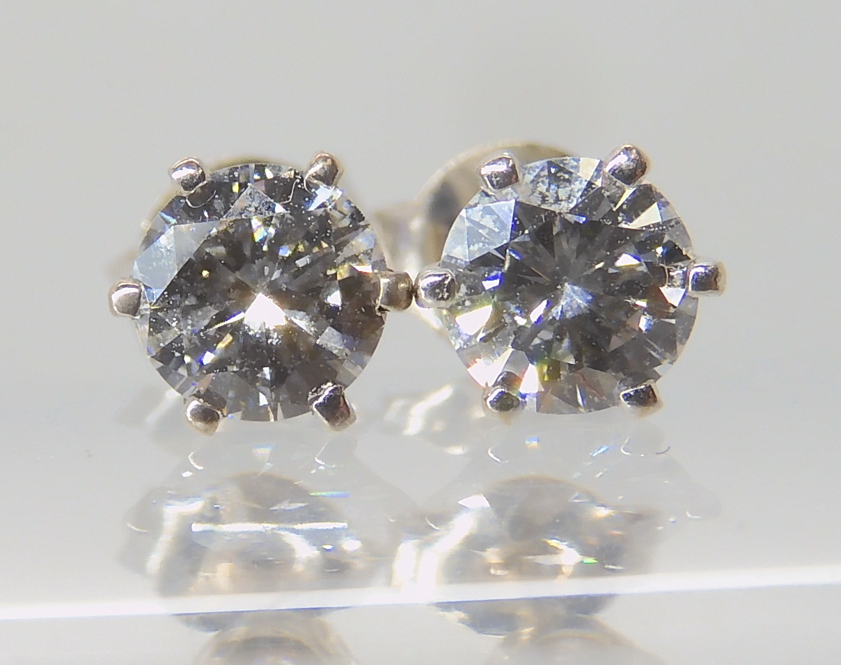 A pair of 18ct white gold diamond ear studs, set with estimated approx 0.80cts in total of brilliant - Image 2 of 3