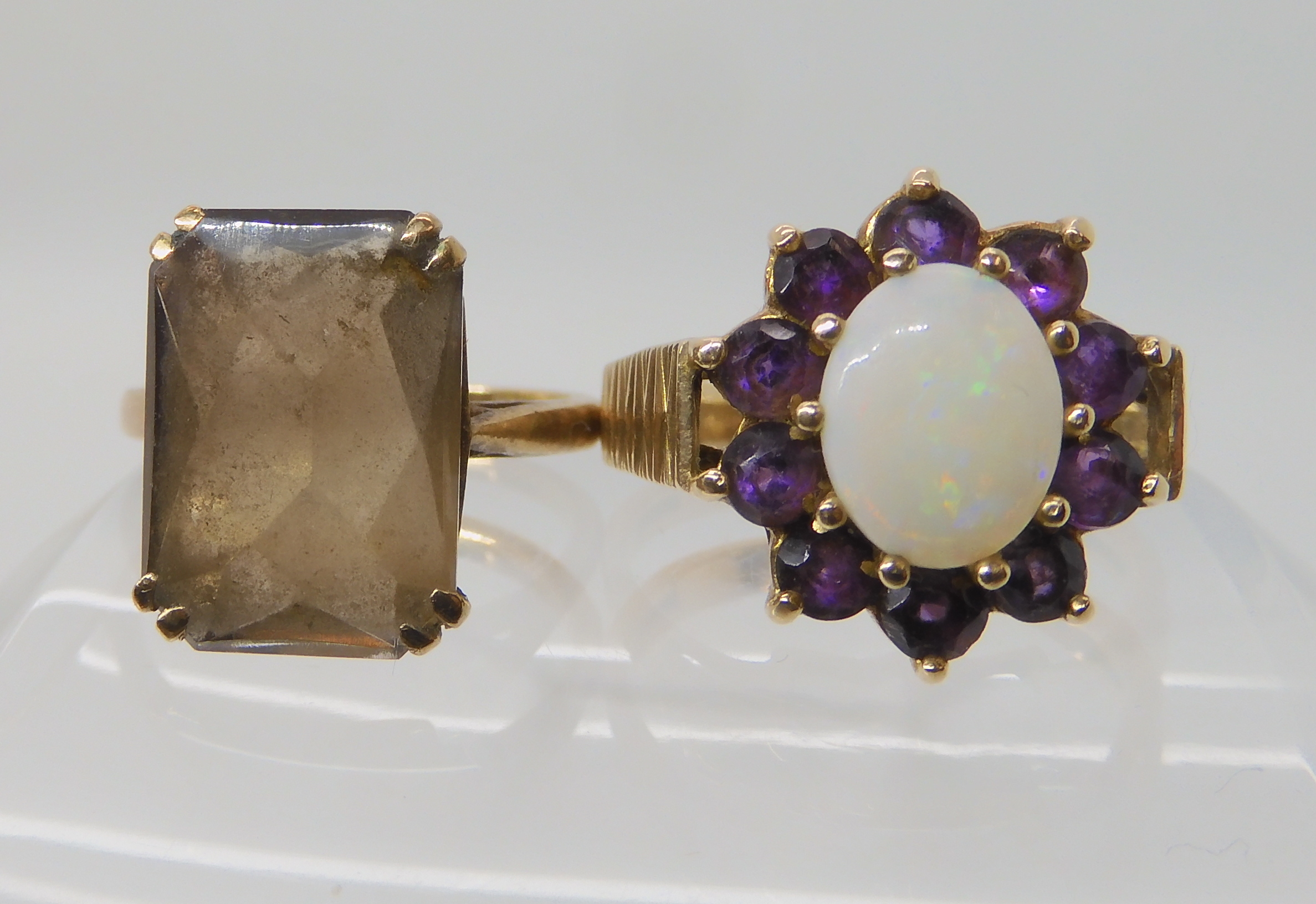 A 9ct retro amethyst and opal cluster ring size O1/2 and a smoky quartz ring size K1/2, weight