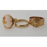 A 9ct cameo ring size N, a rose gold buckle ring size O and a wedding ring size L1/2, combined