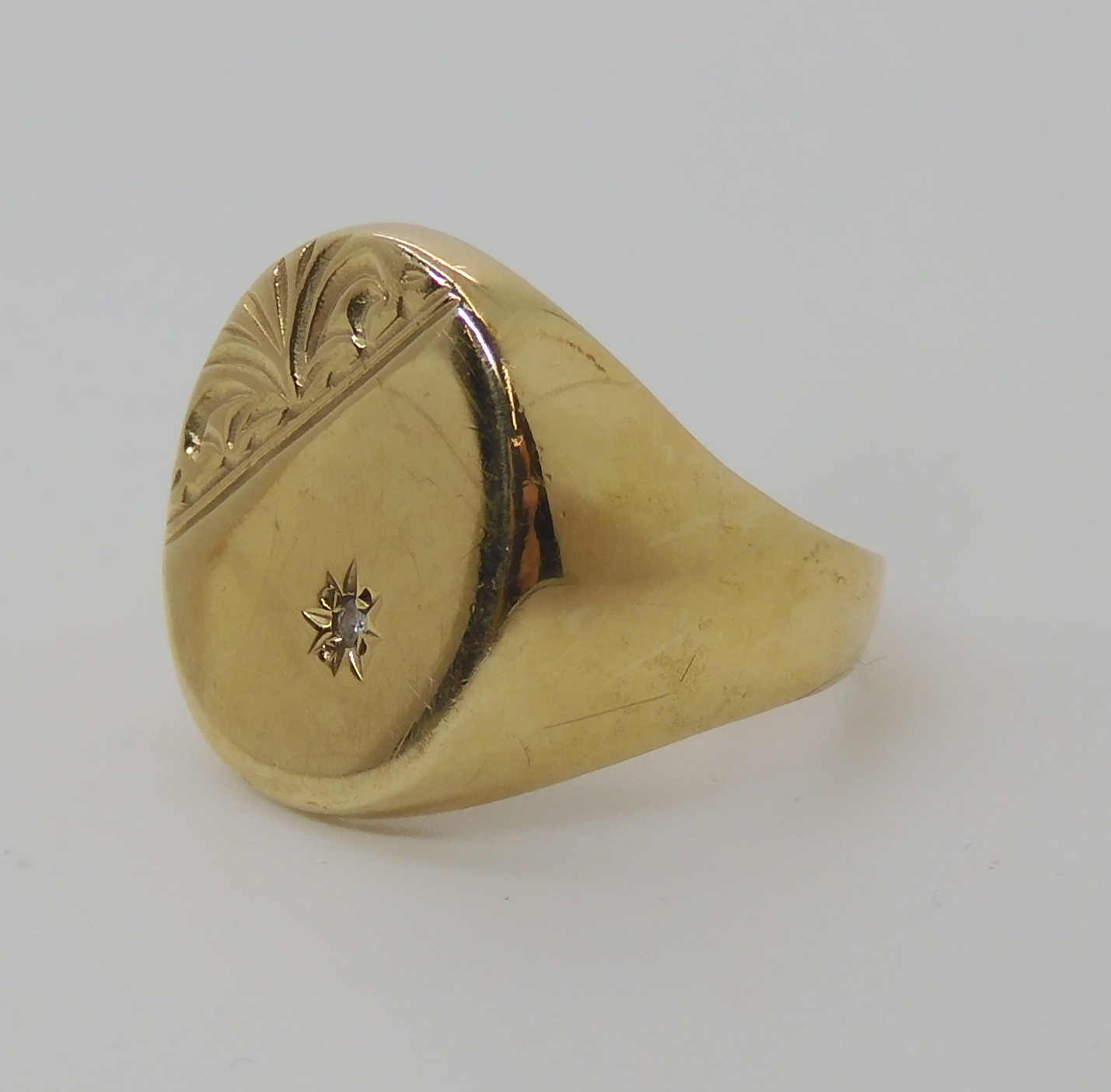 A 9ct gold gents signet ring set with a diamond, finger size R1/2, weight 5.7gms Condition Report: - Image 2 of 3