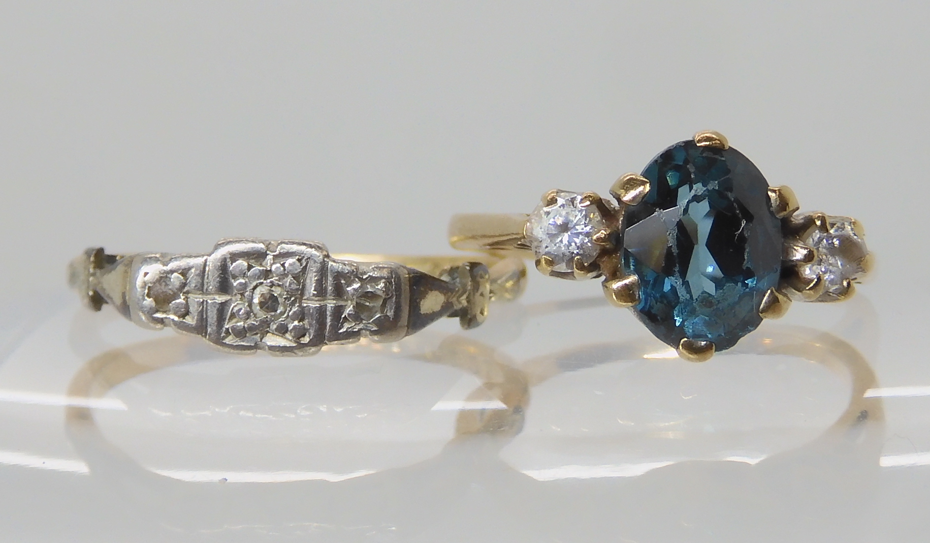 A 9ct vintage diamond accent ring size N, and a blue and clear gem set 9ct ring, size J1/2, combined