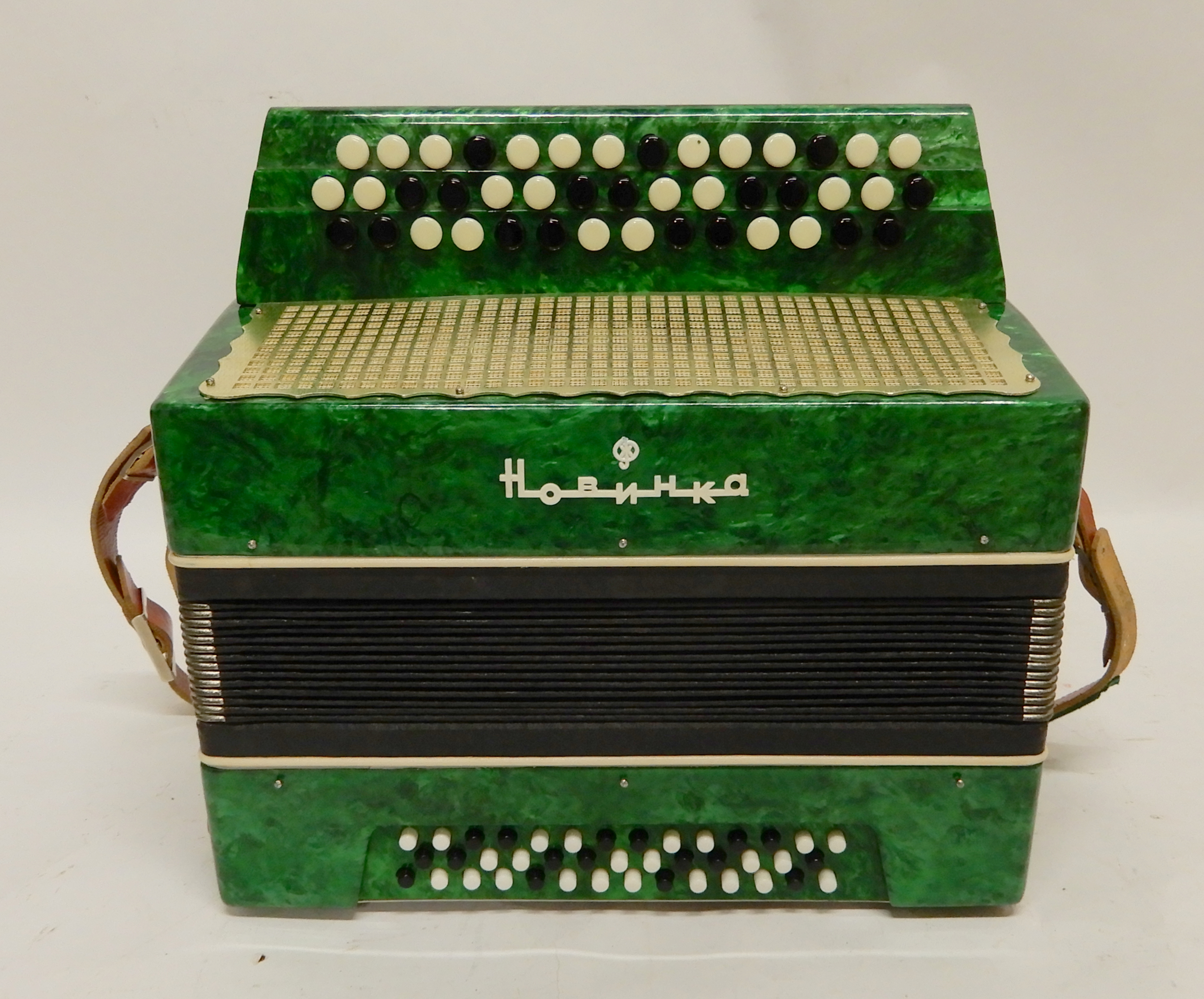 A Russian "Novelty" 43 x 41 button accordion in green Condition Report: Available upon request