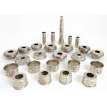 A full set of silver Highland bagpipe projecting mounts, mouthpiece, ferrules and tops, twenty