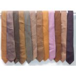A COLLECTION OF TWELVE HERMES SILK TIES of varying designs (12) Condition Report: Available upon