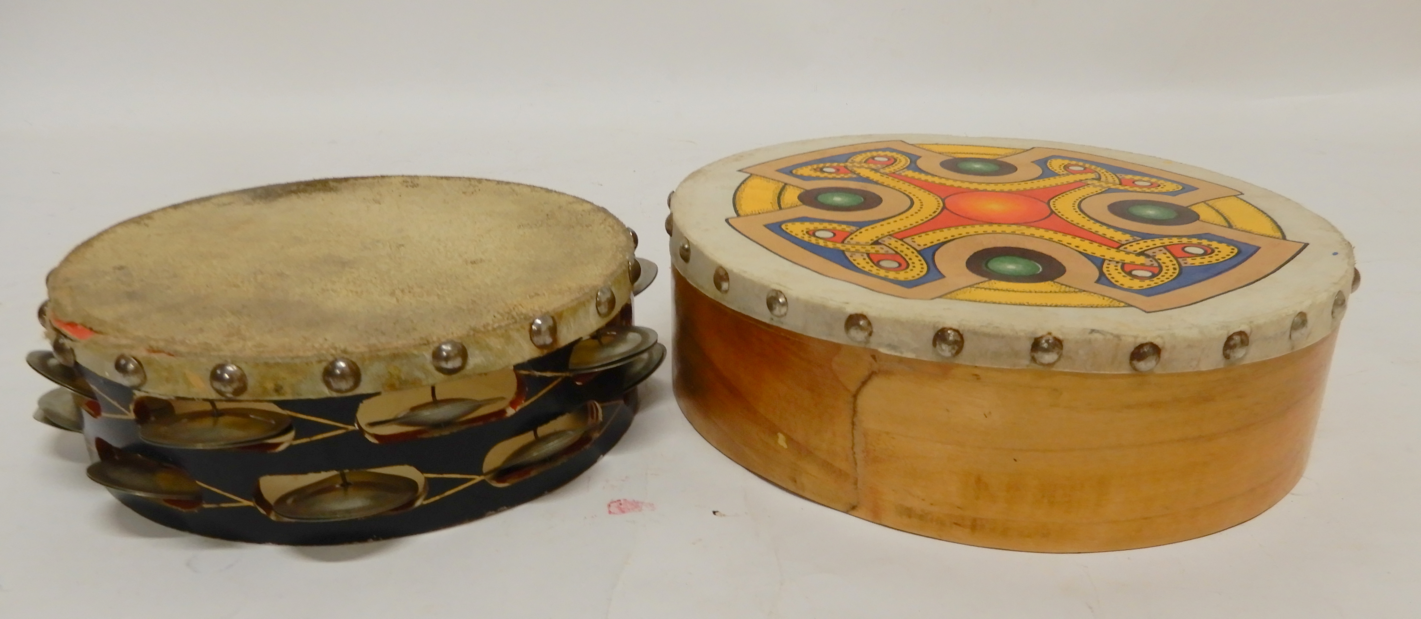 A tambourine and a decorative bohdrain 10" Condition Report: Available upon request