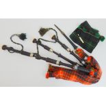 A set of Lawrie highland bagpipes Condition Report: Requires restoration, various cracks.