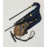 A set of Scottish small pipes, brass mounted with ebony bellows, together with a practise chanter