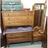 A pair of oak three drawer chests 74cm high x 107cm wide, a matching cheval mirror and an oak