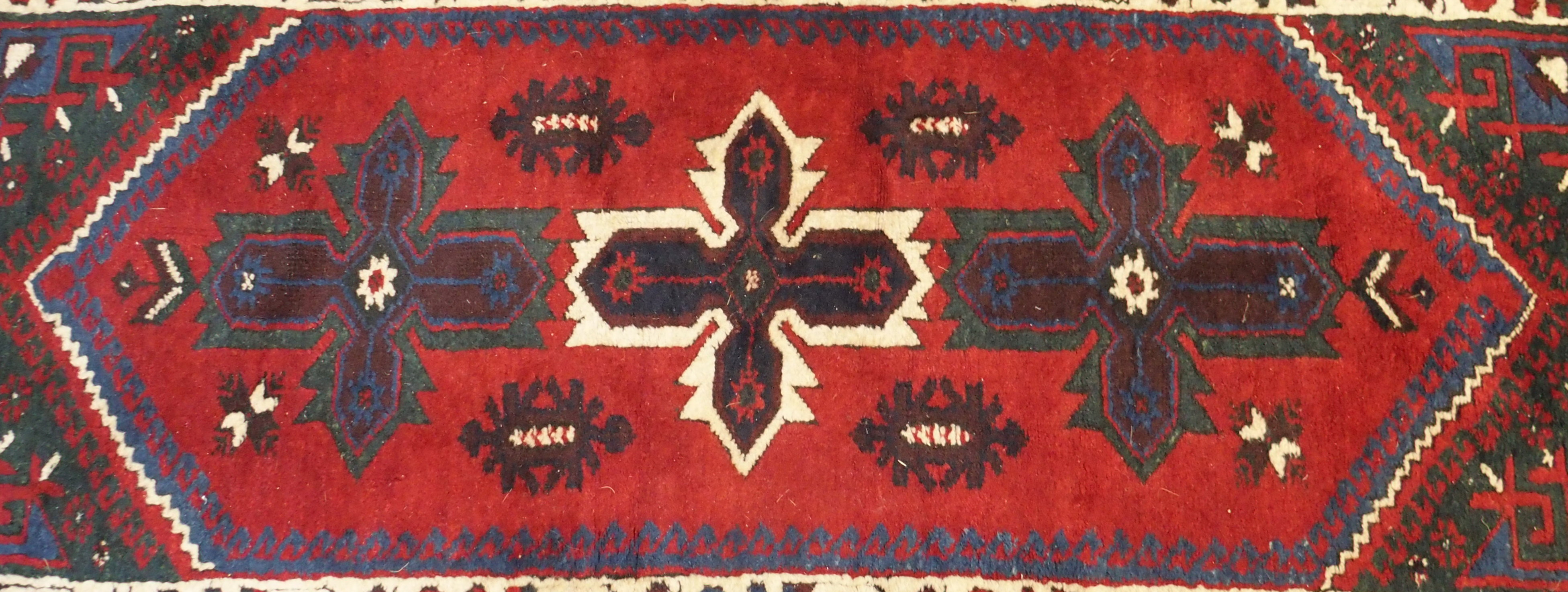 A red ground Eastern rug, 204cm x 120cm, a wool rug, 160cm x 122cm, a Chinese style rug, two - Image 2 of 4