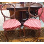 A pair of Victorian mahogany carved balloon back chairs (2) Condition Report: Available upon