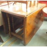 An oak drop leaf table Condition Report: Available upon request