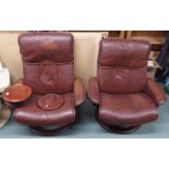 A pair of dark tan Ekorness Stressless swivel chairs (2) Condition Report: Available upon request