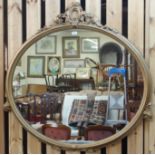 A gilt and gesso oval wall mirror, 120cm high x 120cm wide Condition Report: Available upon request