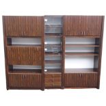 A set of three 20th Century faux rosewood veneer cabinets, two cabinets with open shelves, drop