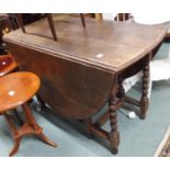 An oak drop leaf table with barley twist supports Condition Report: Available upon request