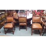 A reproduction circular dining table, 150cm diameter with six dining chairs and two carvers with