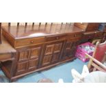 A reproduction mahogany sideboard with three drawers over three panel doors 85cm high x 175cm wide