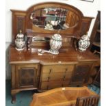 A mahogany mirror back sideboard with carved panels and doors, 173cm high x 152cm wide Condition