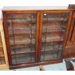 A stained oak glazed bookcase, 145cm high x 40cm wide Condition Report: Available upon request