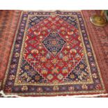 A red ground Hamadan rug with blue central medallion and matching spandrels, 170cm x 150cm Condition