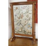 A walnut firescreen with woolwork inset Condition Report: Available upon request