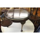 A circular occasional table with ball and claw feet Condition Report: Available upon request