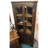 A carved oak corner cabinet, 167cm high x 70cm wide Condition Report: Available upon request