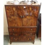 A walnut highboy with two doors and three drawers, 133cm high x 82cm wide Condition Report:
