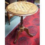 An inlaid games table on tripod base Condition Report: Available upon request