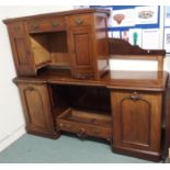 A Victorian mahogany breakfront sideboard and a mahogany desk (def) Condition Report: Available upon