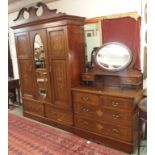 An Edwardian mahogany inlaid wardrobe with central mirror, 234cm high x 162cm wide and a matching