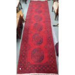 A red ground Eastern runner, 285cm x 77cm and a red ground rug, 150cm x 95cm (2) Condition Report: