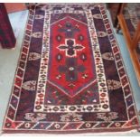 A red ground Eastern rug, 204cm x 120cm, a wool rug, 160cm x 122cm, a Chinese style rug, two