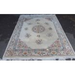 A large floral wool rug Condition Report: Available upon request