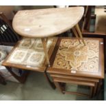 An Ercol side table with drop leaf, a nest of tables with tile top and a tile top side table (3)