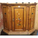 A pine cabinet with single door with painted panels of a bird and flowers, 76cm high x 92cm wide