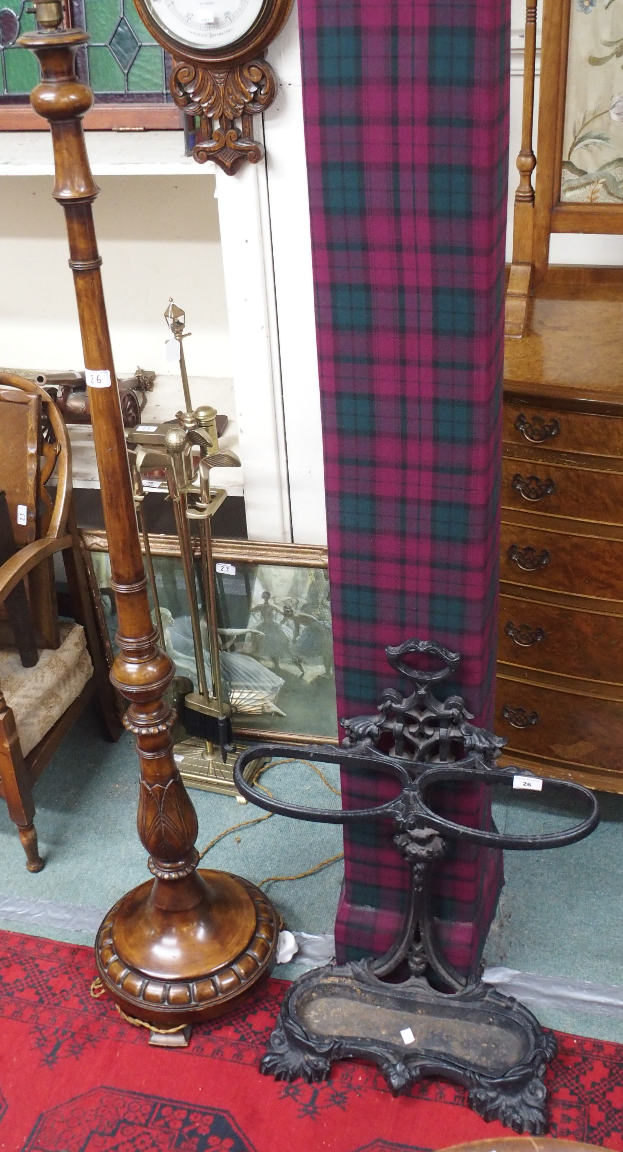 A cast iron stick stand and a standard lamp (2) Condition Report: Available upon request
