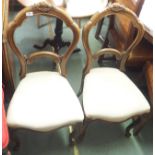 A pair of Victorian mahogany balloon back dining chairs (2) Condition Report: Available upon