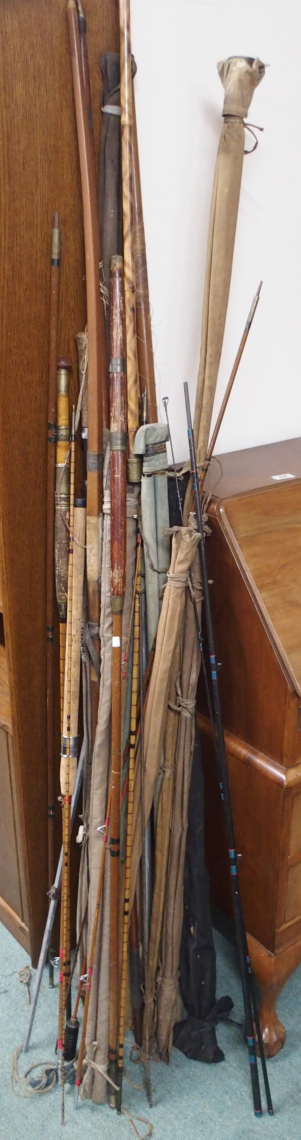A selection of fishing rods, gaff etc Condition Report: Available upon request